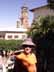 [Photo of Kathy with cathedral spires in background]