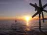 [Sunrise towing sailboat]