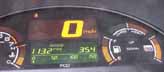 [Photo of instrument panel showing 113.2mpg at 35.4 miles driven]