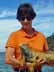[Kathy holding iguana]