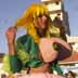 [Made-up stilt walker with fake boobs]